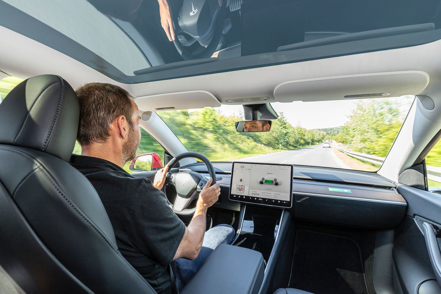 Tesla Model Y interior driving